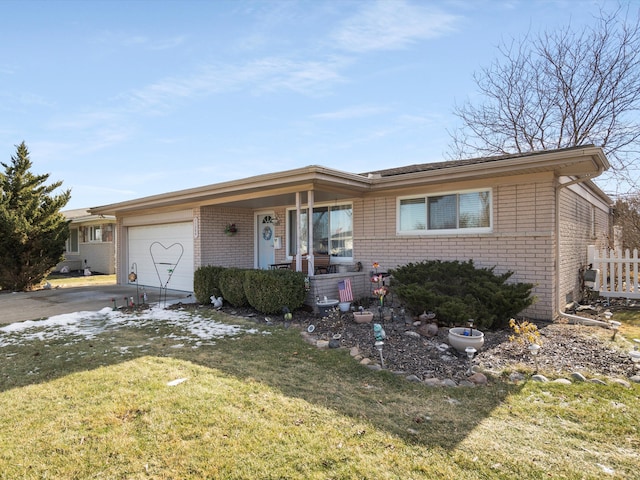 ranch-style home with a garage and a front yard