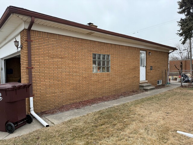 view of side of home featuring a yard