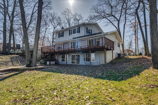 back of property with a yard, central AC unit, a chimney, and a wooden deck