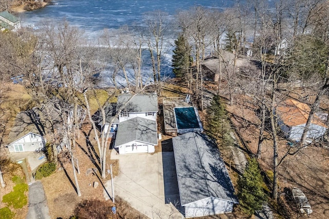 birds eye view of property with a water view