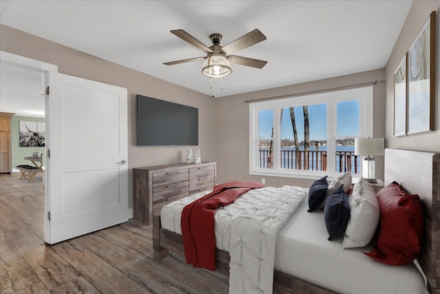 bedroom with ceiling fan and light wood finished floors