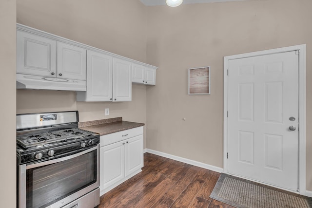 kitchen featuring dark hardwood / wood-style floors, gas stove, and white cabinets