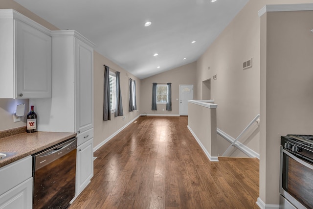 kitchen with hardwood / wood-style floors, white cabinetry, dishwasher, lofted ceiling, and stainless steel gas range oven