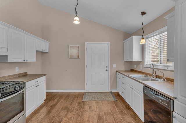 kitchen featuring hanging light fixtures, stainless steel gas range oven, black dishwasher, and sink