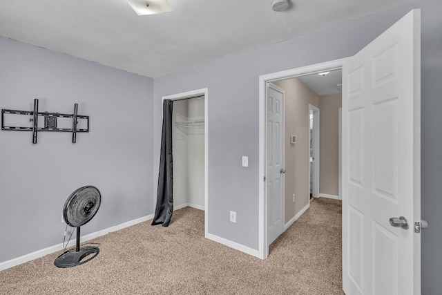 carpeted bedroom with a closet