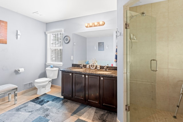 bathroom featuring walk in shower, tile patterned floors, vanity, and toilet