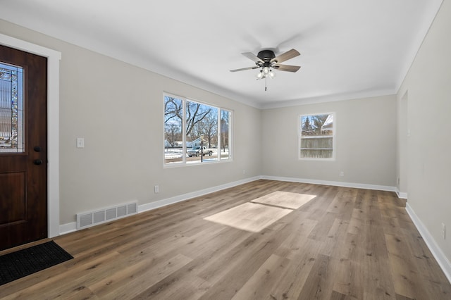 foyer entrance featuring ceiling fan and light hardwood / wood-style floors