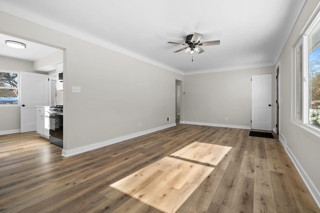 unfurnished room featuring wood-type flooring and ceiling fan