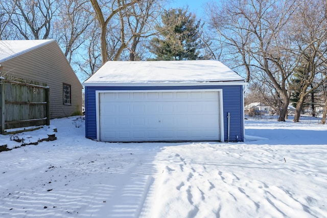 view of snow covered garage