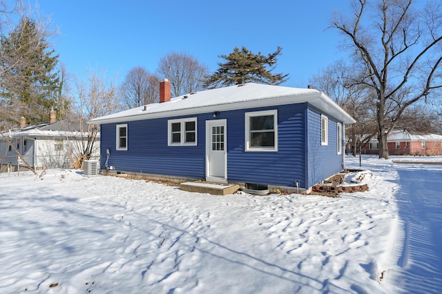 snow covered property featuring cooling unit