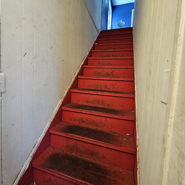 stairway with wooden walls