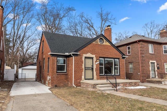 view of front of property featuring an outbuilding and a garage