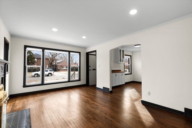 unfurnished living room with dark hardwood / wood-style flooring