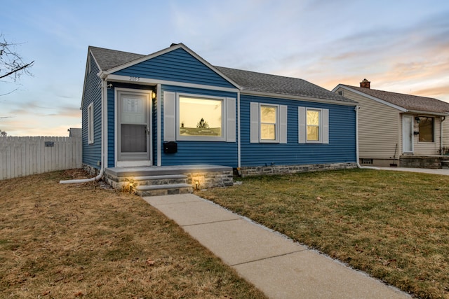 view of front of house with a yard