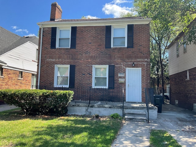 view of front of home with a front lawn