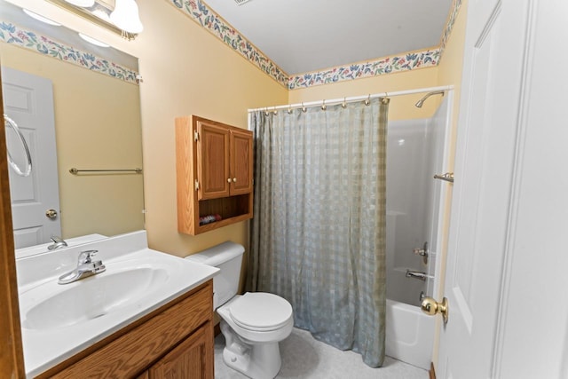 full bathroom with vanity, toilet, and shower / bath combo with shower curtain