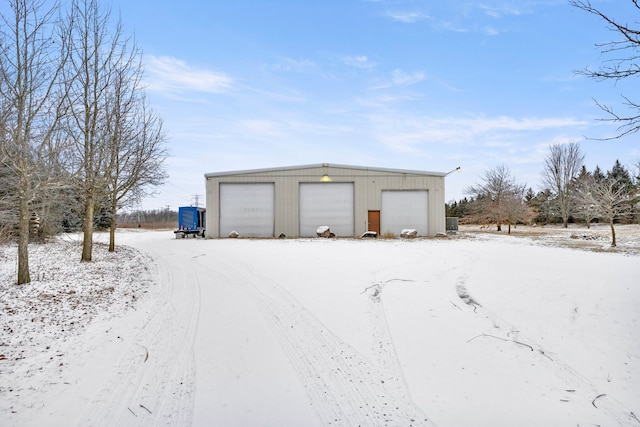 view of snow covered garage