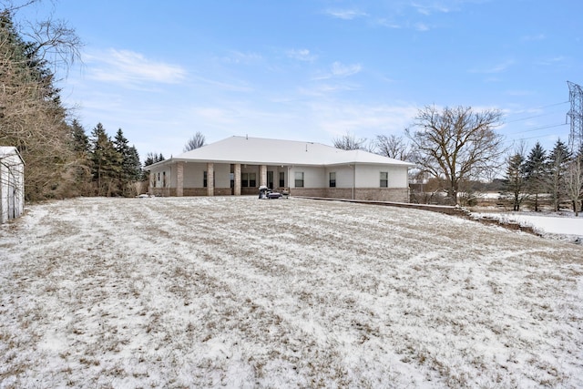 view of snow covered house