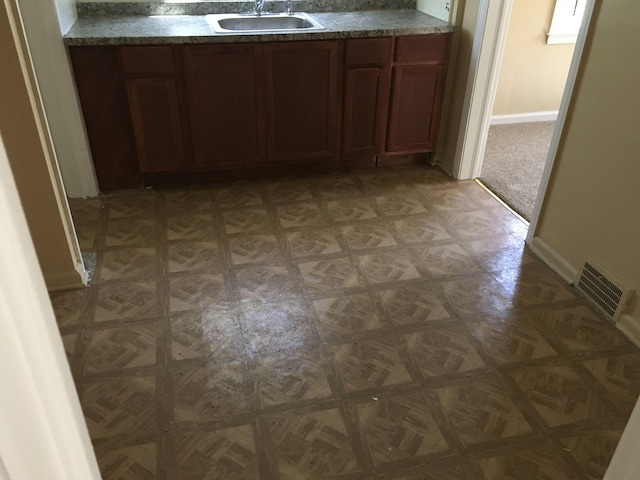 interior space with sink and parquet floors