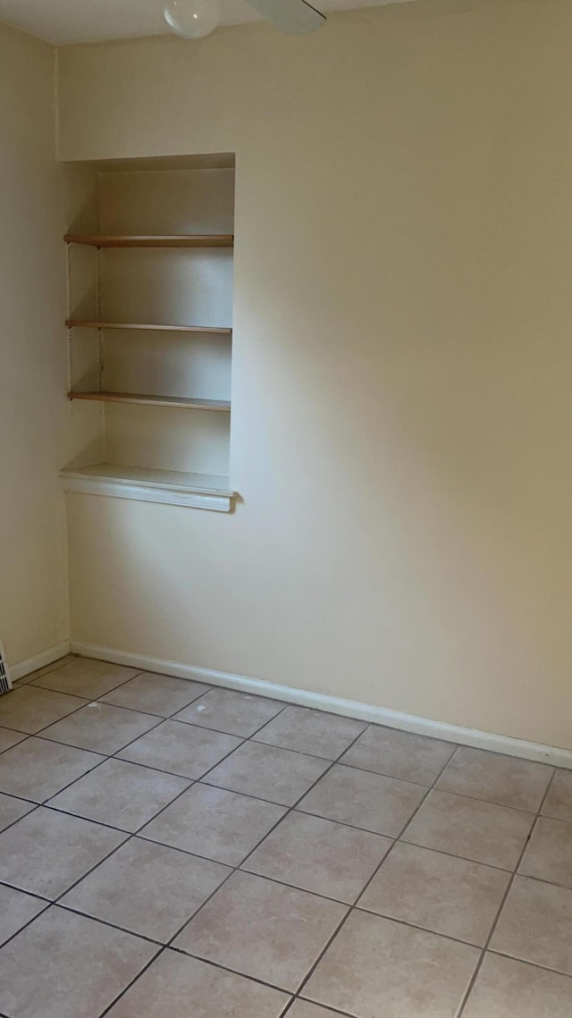 spare room with light tile patterned floors