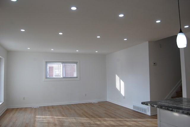 empty room with light hardwood / wood-style floors