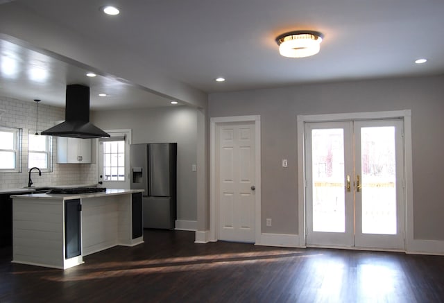 kitchen with french doors, sink, extractor fan, white cabinetry, and appliances with stainless steel finishes