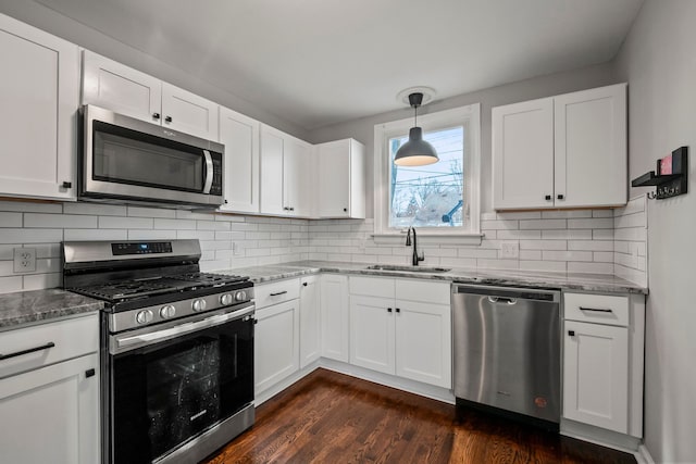 kitchen featuring white cabinetry, sink, and appliances with stainless steel finishes