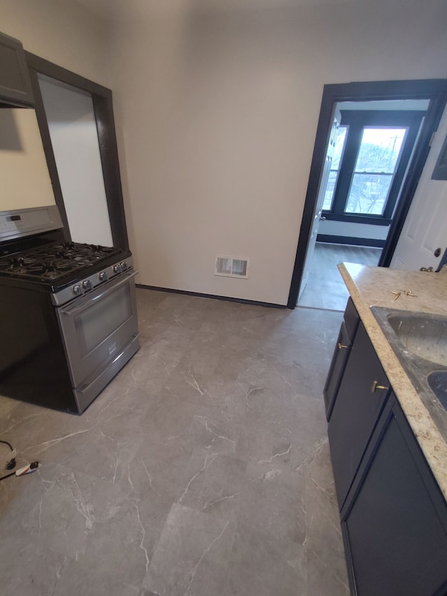 kitchen featuring stainless steel range with gas stovetop