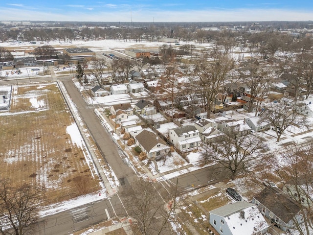 snowy aerial view with a residential view