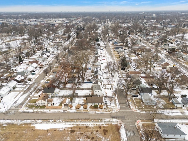 snowy aerial view featuring a residential view