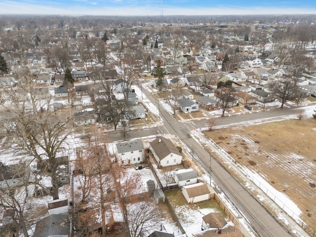 snowy aerial view featuring a residential view