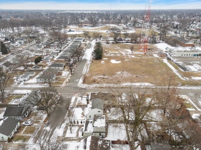 snowy aerial view with a residential view