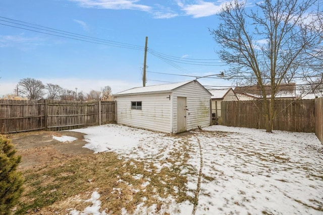 exterior space with an outbuilding, a fenced backyard, and a storage unit