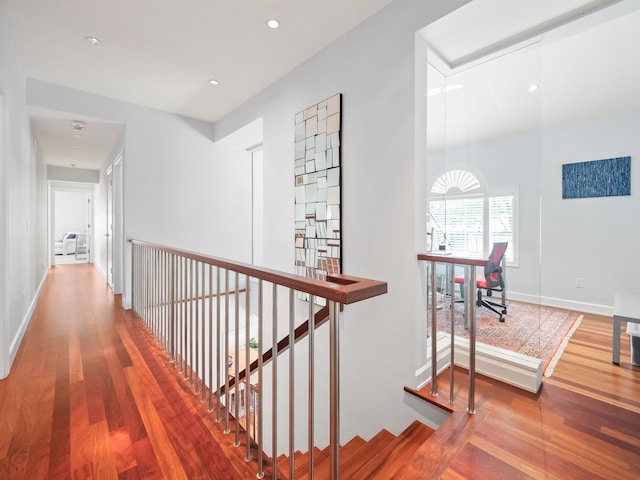 corridor with hardwood / wood-style floors
