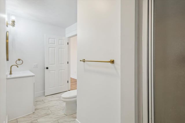 bathroom with vanity and toilet