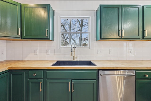 kitchen with dishwasher, sink, and green cabinets