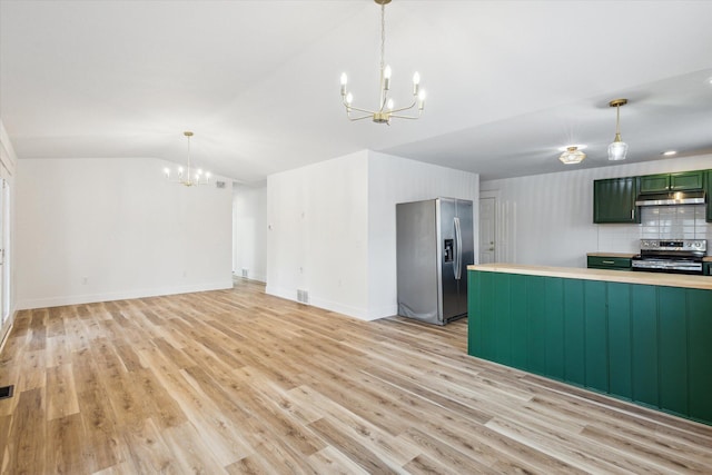 kitchen featuring appliances with stainless steel finishes, pendant lighting, a chandelier, light hardwood / wood-style floors, and green cabinetry