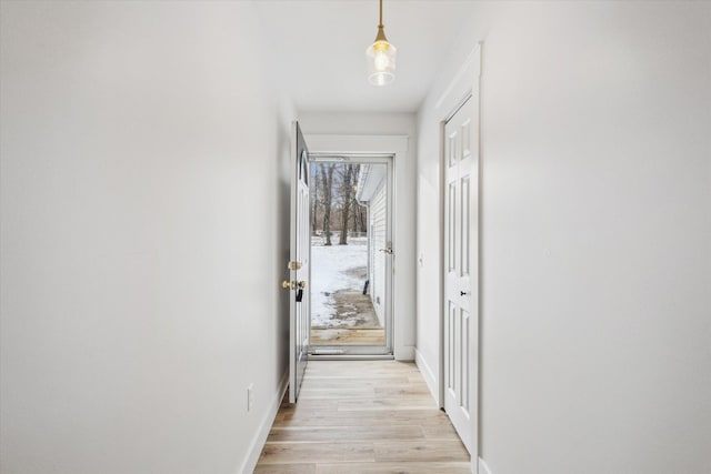 hall with light hardwood / wood-style floors