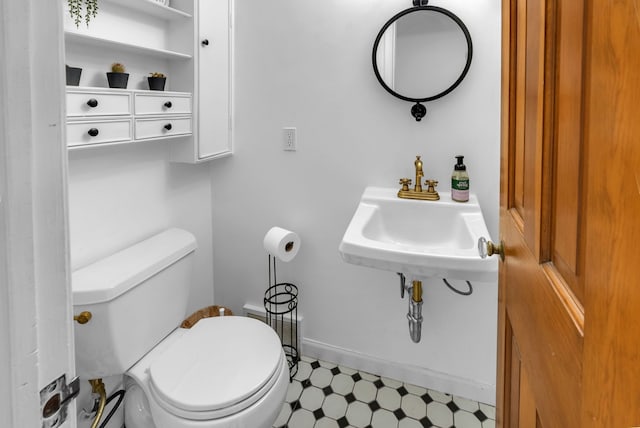 bathroom featuring sink and toilet