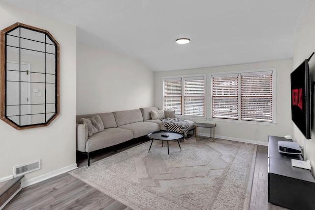 living room with light hardwood / wood-style floors