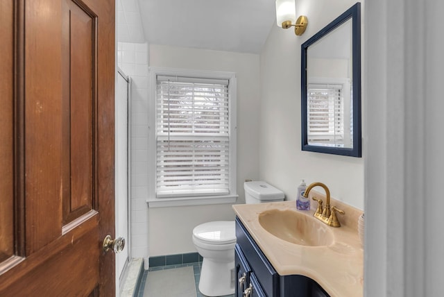 bathroom with walk in shower, a healthy amount of sunlight, and vanity