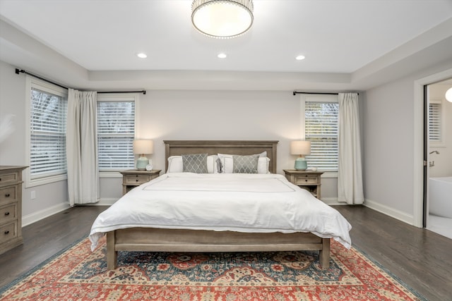 bedroom with dark wood-type flooring