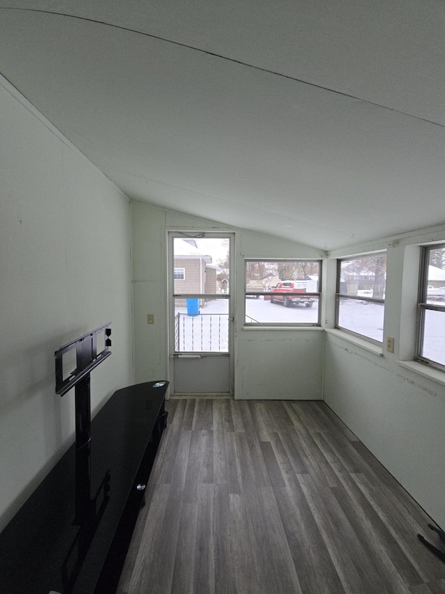 unfurnished sunroom featuring vaulted ceiling