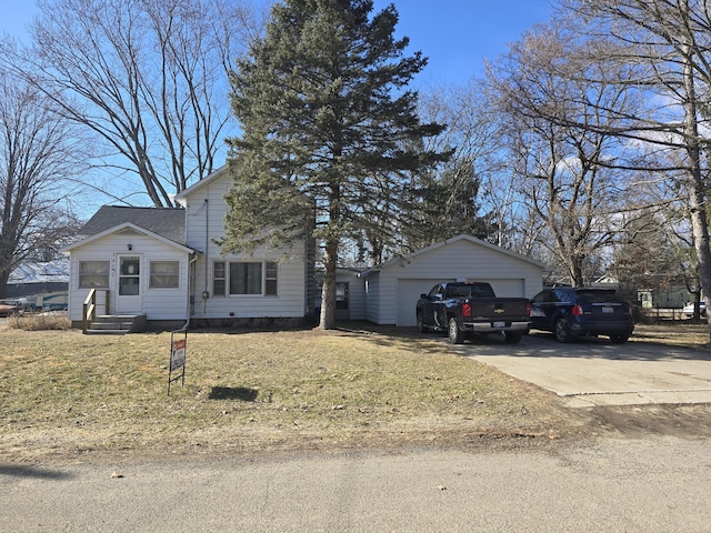 traditional-style home with a garage, crawl space, an outdoor structure, and a front lawn