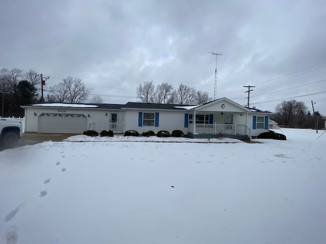 single story home with a garage and covered porch