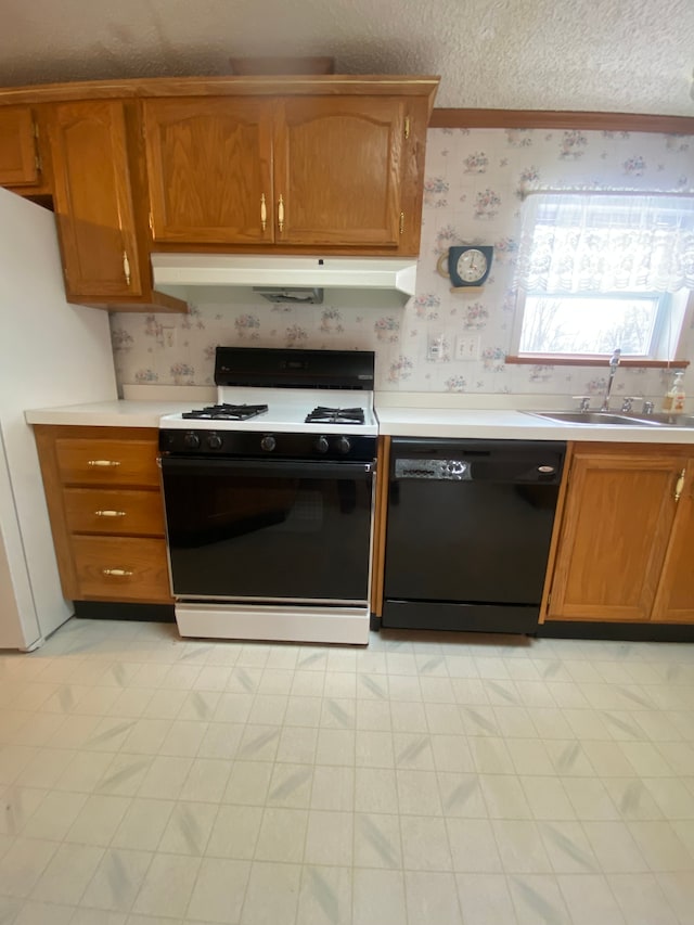 kitchen with sink, a textured ceiling, range with gas stovetop, dishwasher, and white fridge