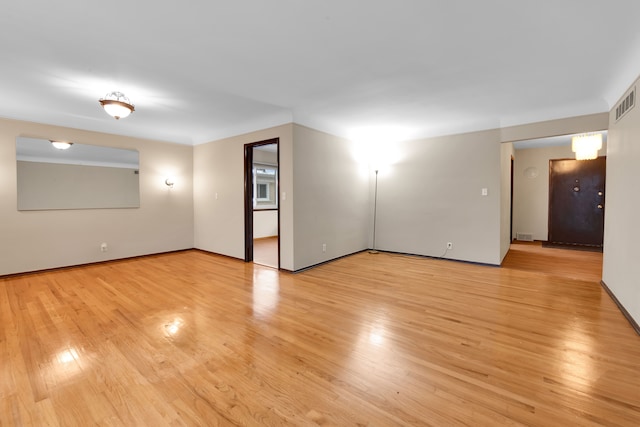 spare room featuring light hardwood / wood-style flooring