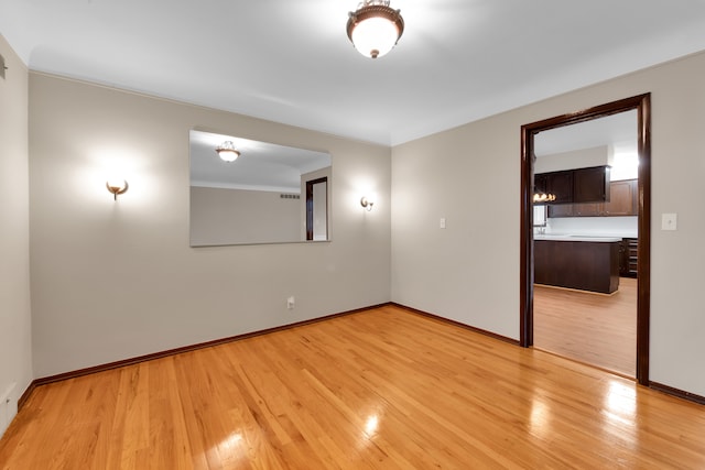 spare room with light hardwood / wood-style floors