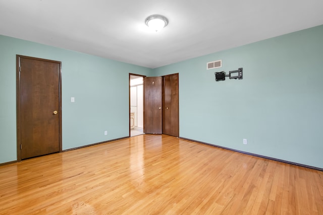 unfurnished bedroom with light hardwood / wood-style floors