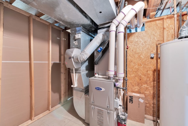 utility room featuring water heater